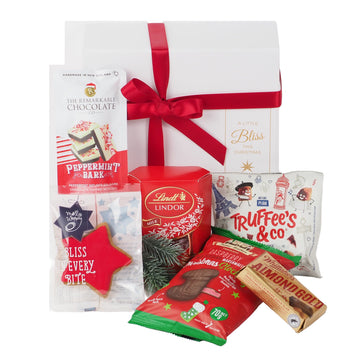 Delight them with the Mistletoe Gift Box - a beautifully presented white gift box filled with chocolates and sweet festive treats.