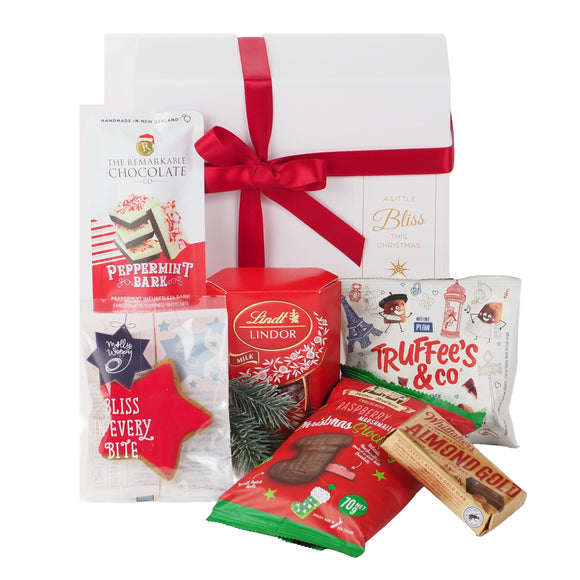 Delight them with the Mistletoe Gift Box - a beautifully presented white gift box filled with chocolates and sweet festive treats.