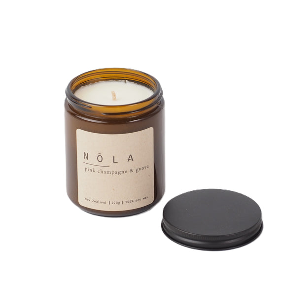 The Art of feeling at Home - Pink champagne and guava Nola Candle is a bliss favourite: 220g

Pink grapefruit, bergamot and lemon create a sweet and tart aroma, while guava, passionfruit and pink champagne add a sweet layer of complexity. Vanilla, elderflower and oriental jasmine simmer through to offer balance. A tropical getaway... in a candle.

Safe fragrances: free from phthalate
100% soy wax: free from paraffin, GMO and unnatural additives
Clean burning: sustainably-sourced wooden wicks or 